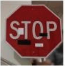 Published stop-sign example with adversarial black stickers from Eykholt and colleagues.